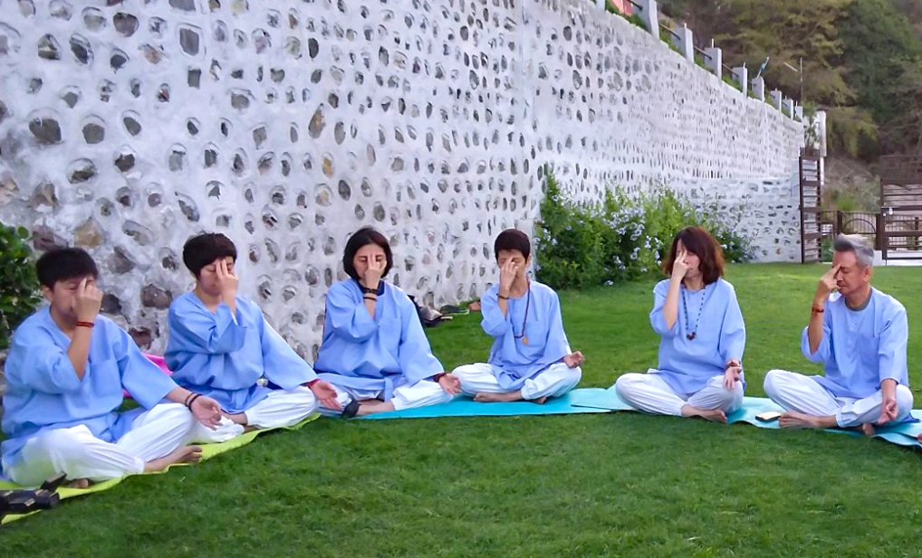 A group of people Sitting on Paranyam Posture