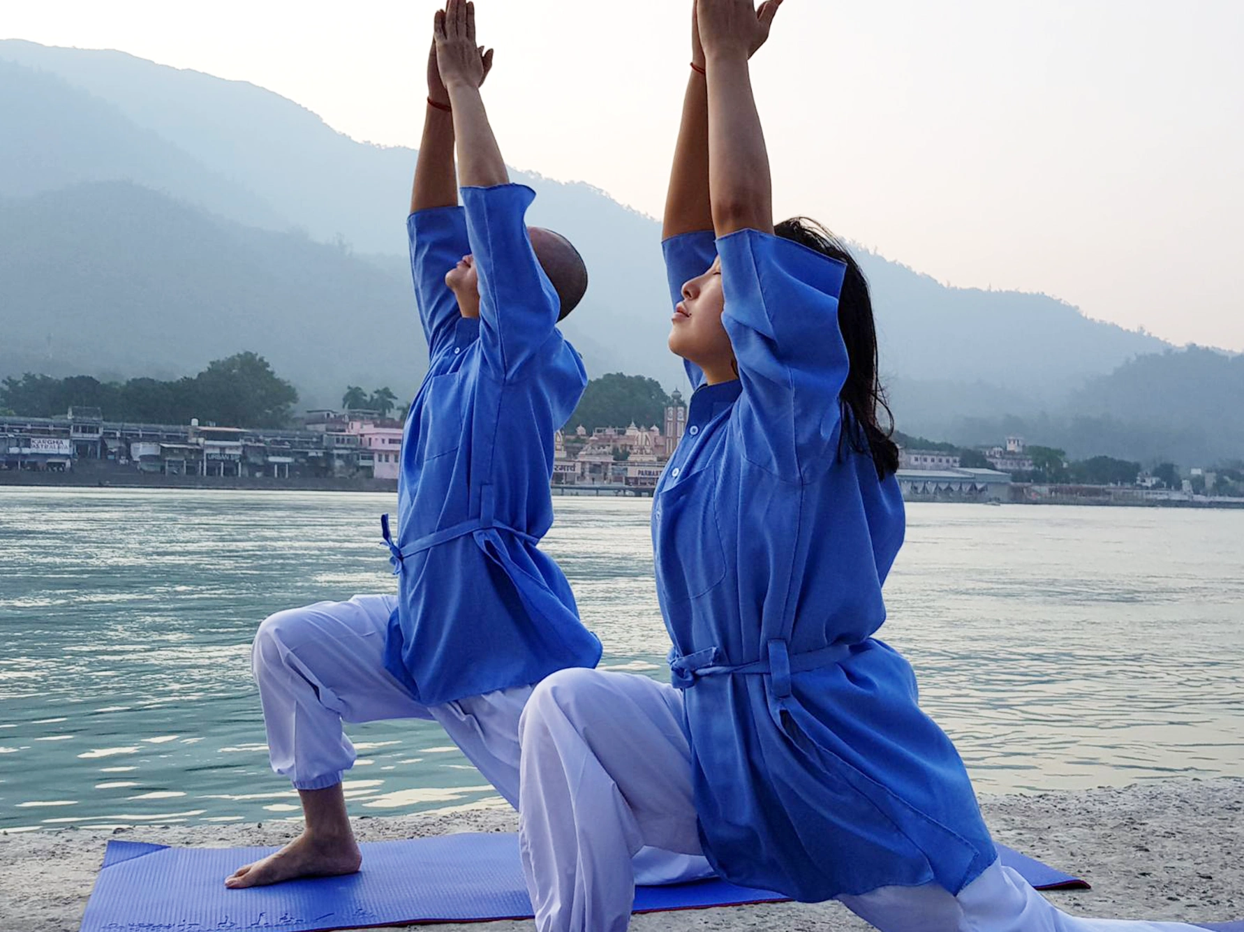 Two girls doing Hatha Yoga on Riverside